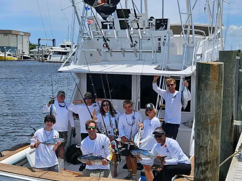 Happy crew with the day's catch at the dock